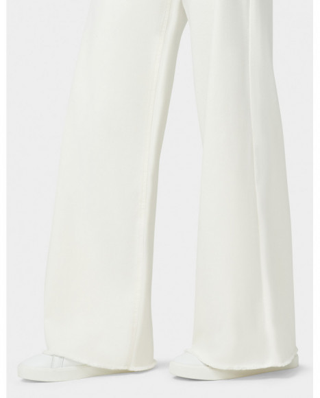 Pantalón mujer denim color blanco bajo deshilachado con pierna ancha y elástico Pantalón mujer denim color blanco bajo deshilachado con pierna ancha y elástico